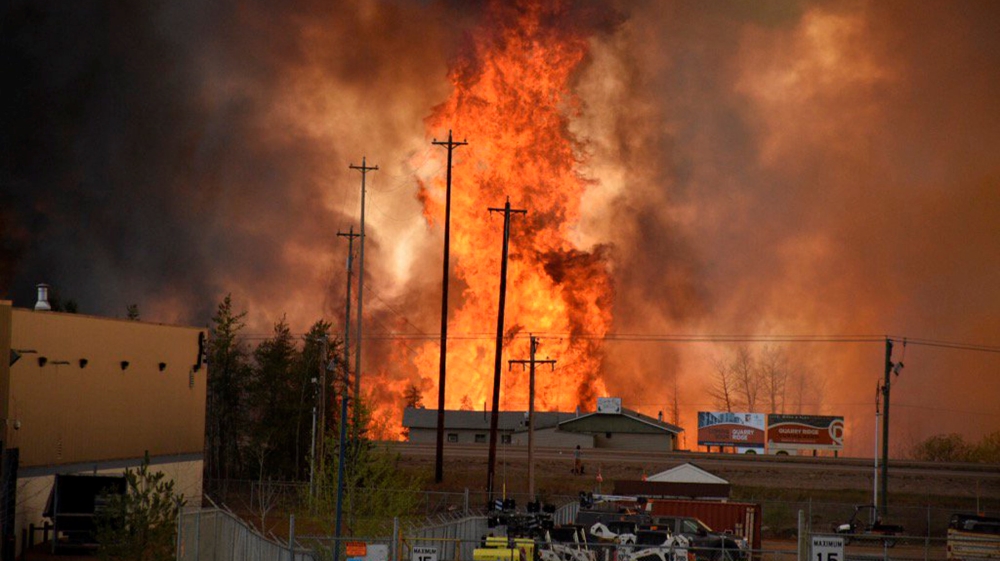 More than 1,600 structures, including hundreds of homes, have been destroyed [CBC News/Handout via Reuters/Terry Reith]