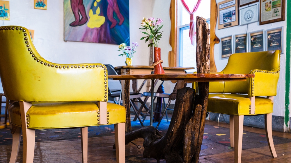 'Without the customers we don't exist: the thinkers and the photographers, and the sculptors and the writers; the poets and the civil rights activists,' Ayman says [Angelo Merendino/Al Jazeera]