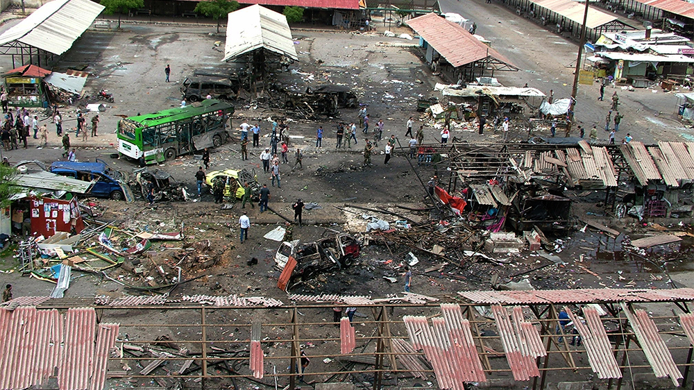 Dozens were killed in Tartus when a car bomb went off in the bus station [AP/SANA handout]