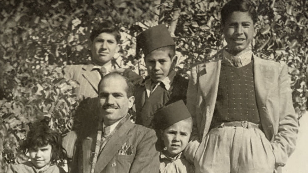  The Only Surviving Picture from al-Ma'in village. Taken in 1944, it shows Abu Sitta standing on his left, wearing Tarbouch, with members of his family [Courtesy of Salman Abu Sitta family album]