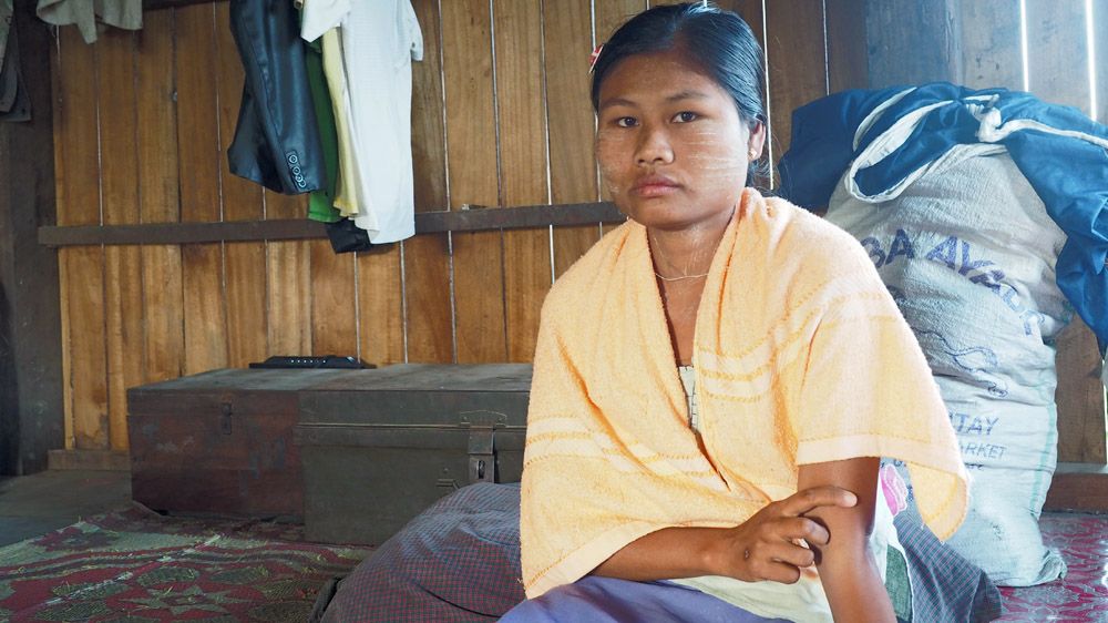 Nygi La Thein, 26, the granddaughter of Daw Tin Thant, attempted suicide by drinking the same pesticides as her uncle in May 2015, but she survived [Connor Macdonald/Al Jazeera] 