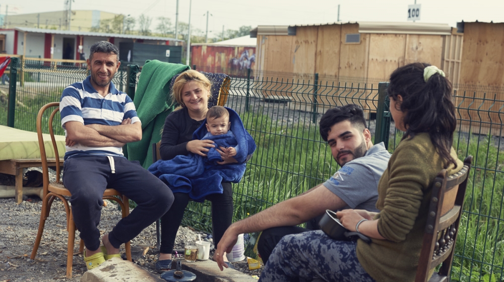 Many Kurdish families in the Liniere camp say relatives in England are the main reason for trying to reach the UK [Jasper Clarke/Al Jazeera]