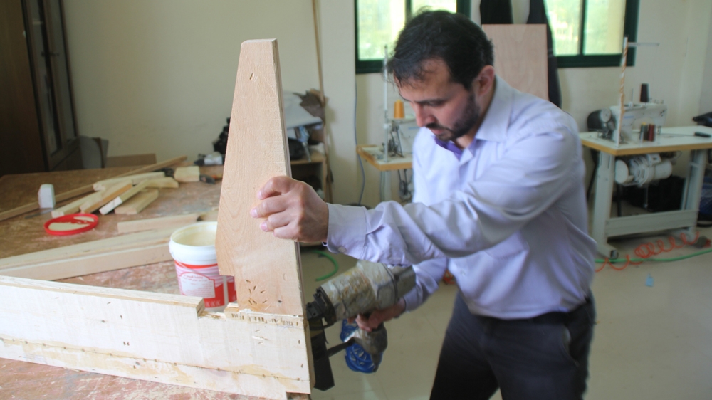  Mohammed Ajour says he used to earn an average of 2,500 shekels per month; now, he barely makes 800 [Belal Aldabbour/Al Jazeera]