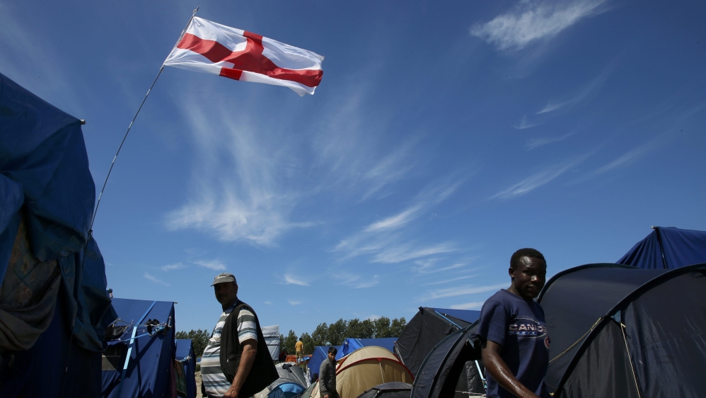 An England flag flies above a shelter in the make-shift immigrant camp called the jungle, in Calais, France, after Britain''s referendum results to leave the European Union were announced