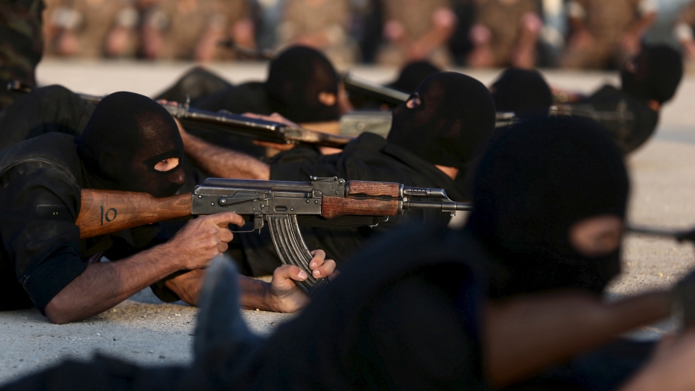  Rebels demonstrate their skills during a graduation ceremony at a training camp near Damascus [Bassam Khabieh/Reuters] 