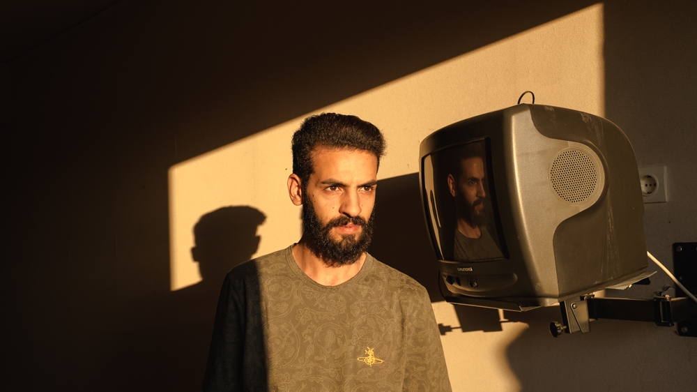 Rabee Abo Tarah volunteers as a translator in the squat [Nick Paleologos/SOOC/Al Jazeera]