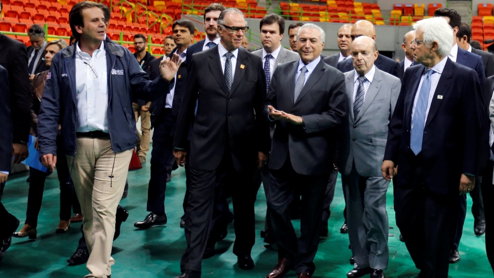 Reports say Temer, third from left, will announce the emergency funds on Monday [Reuters]