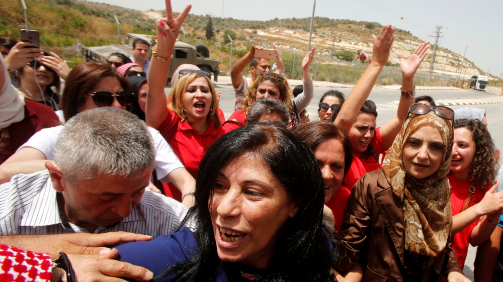 Palestinian lawmaker Khalida Jarrar is welcomed by Palestinian activists following her release from an Israeli jail at Israeli Jbara checkpoint near the West Bank city of Tulkarm