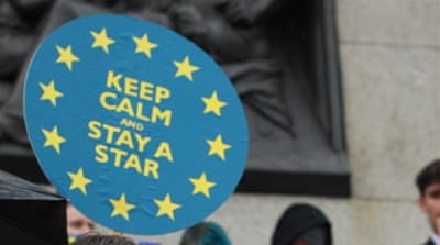 People take part in a demonstration in Trafalgar Square, London, against the