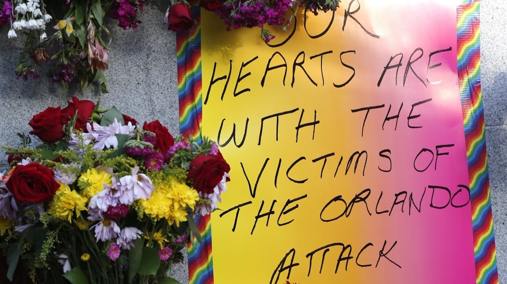Residents of San Francisco and the Bay Area lay flowers and supporting messages as they gather to mourn the victims of a mass shooting at a LGBT nightclub in Orlando, Florida [EPA]