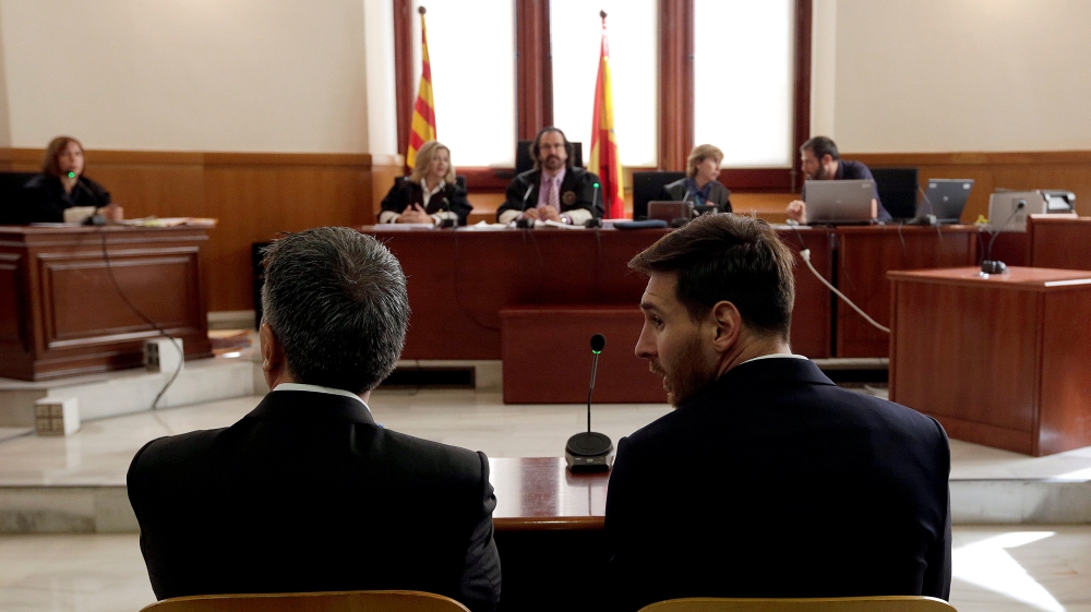 Barcelona''s Argentine soccer player Lionel Messi sits in court with his father Jorge Horacio Messi during their trial for tax fraud in Barcelona