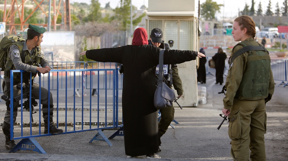 Israeli forces searching palestinian woman