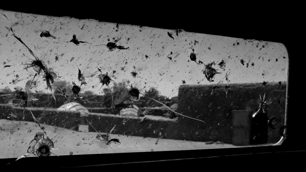 The window of the armoured truck [Marielle van Uitert/Al Jazeera]