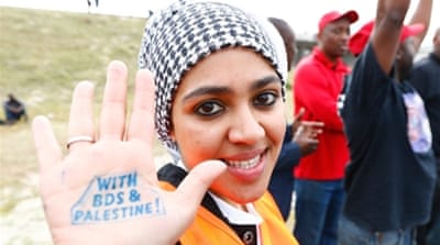 A Pro-Palestinian protester supports the BDS campaign against Israel demonstrates in Cape Town, South Africa [Getty]