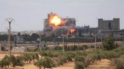 Smoke and flames rise after alleged US-led air strikes on the mills of Manbij where ISIL fighters are positioned, in Aleppo [REUTERS]