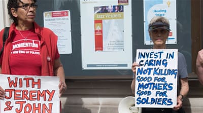 Protesters hold a demonstration outside the Queen Elizabeth II Conference Centre as they wait for the release of the Chilcot Inquiry in London, Britain [EPA]