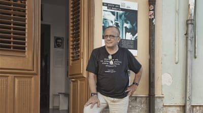 Giovanni Impastato at his anti-mafia association Casa Memoria Peppino e Felicia Impastato in central Cinisi, Sicily [Eileen Quinn/Al Jazeera]