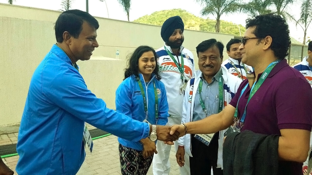 Learning from the best - Karmakar had the opportunity to meet cricketer Sachin Tendulkar (right) [Al Jazeera]