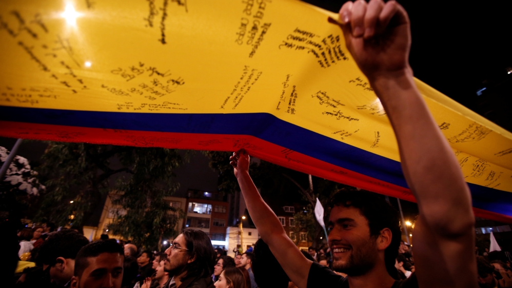 The deal sparked celebrations in parks and bars in the Colombian capital, Bogota [John Vizcaino/Reuters]