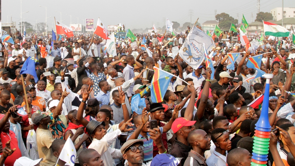 Supporters of Congolese opposition leader Etienne Tshisekedi carry placards and flags as they attend a political rally in the Democratic Republic of Congo''s capital Kinshasa