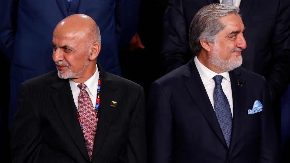 Ghani and Abdullah participate in a family photo with Ghani and Abdullah at the NATO Summit in Warsaw, Poland