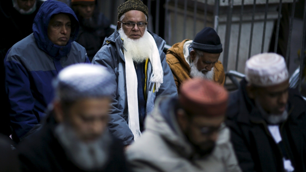 Muslims pray as they take part in a protest against presidential candidate Donald Trump outside of his office in Manhattan