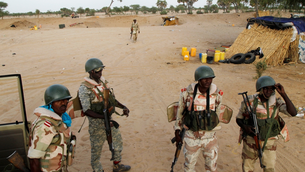 Niger soldiers gather as the prepare to guard towards the border with neighbouring Nigeria, near the town of Diffa