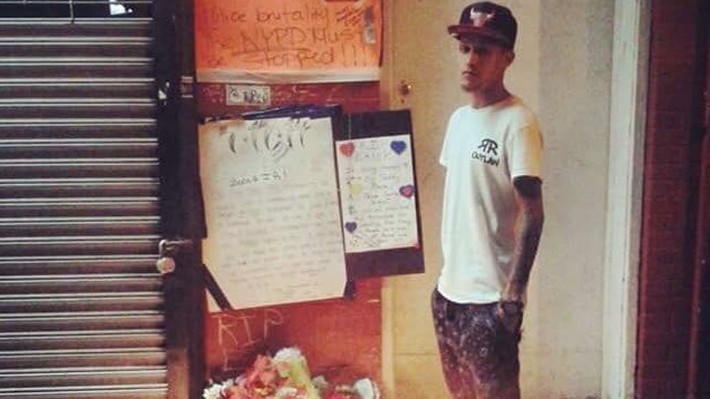 Ramsey Orta, 25, pictured at a shrine to commemorate Eric Garner, at the Staten Island location where he was killed by police [Ramsey Orta/Al Jazeera]