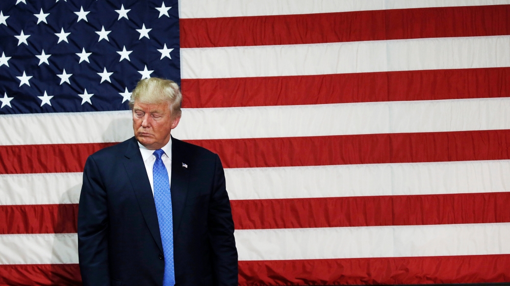 Republican presidential nominee Donald Trump pauses as he speaks at a campaign town hall event in Sandown