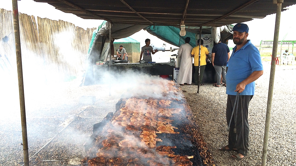 Salalah's speciality food is salty chicken cooked on hot stones drawn from valleys nearby [Baba Umar/Al Jazeera]