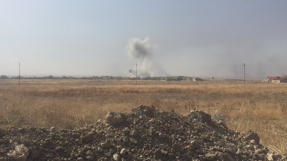 A coalition air strike lands on an ISIL position near Nawaran [Adam Lucente/Al Jazeera]