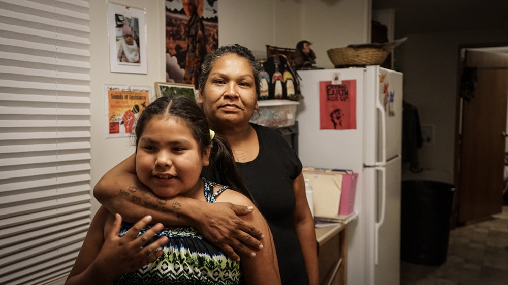 Olowan says she struggled with alcoholism for years before eventually giving it up 11 years after her mother's death   [Patrick Strickland/Al Jazeera] 