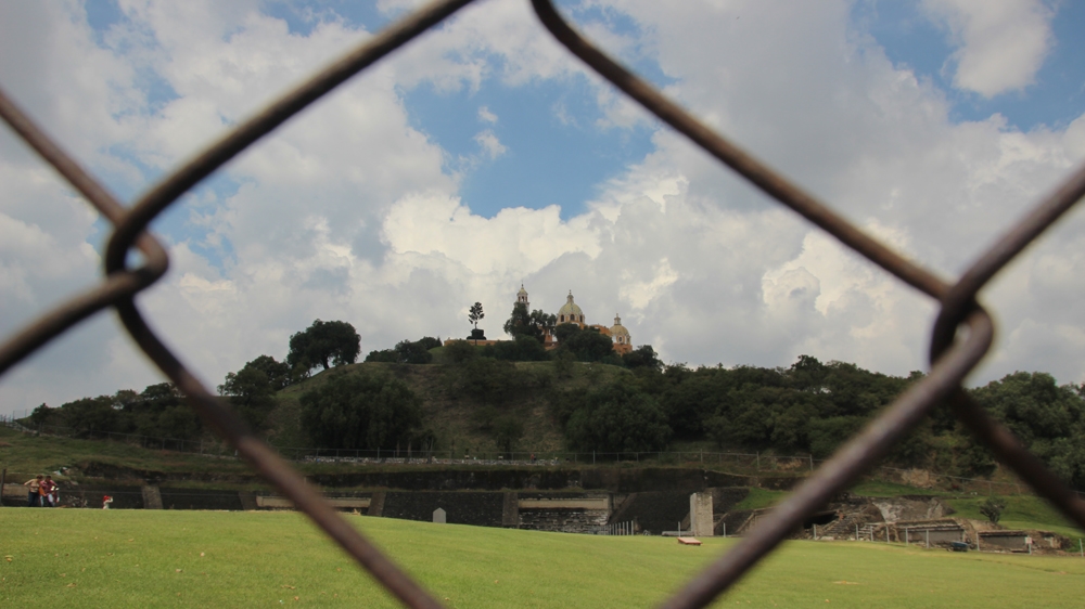 The Great Pyramid of Cholula has only been partially excavated, and for years, was thought to be a natural hill  [Ryan Mallett-Outtrim/Al Jazeera]  
