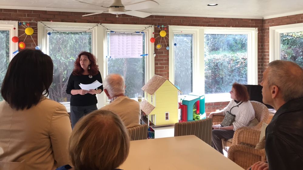 Fran Middleberg tells volunteers what to do in different door-knocking situations [Jessica Sarhan/Al Jazeera]