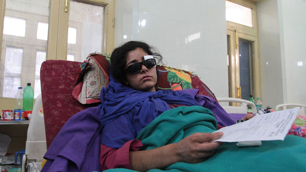  Shabrooza Akhtar’s mother Rafiqa Banoo says when news spread that the army was entering homes, villagers came out to protest.    Akhter was hit on the lawn outside their house   [Shuaib Masoodi/Al Jazeera]