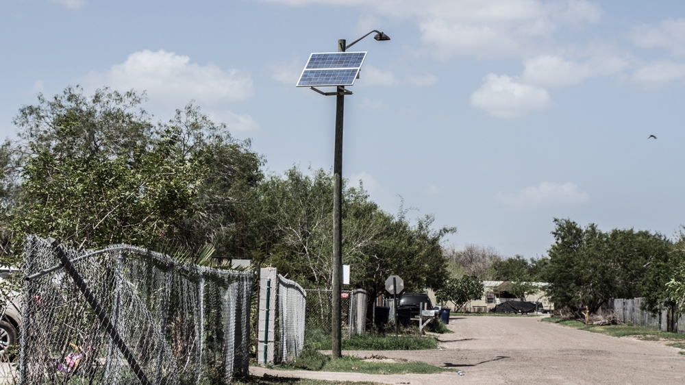 
Located just 17 kilometres outside the border town of Mission, the Mi Sueno colonia is a single, pothole-ridden street lined with wooden and concrete houses, trailers, shacks and car parks [Shaghayegh Tajvidi/Al Jazeera] 
