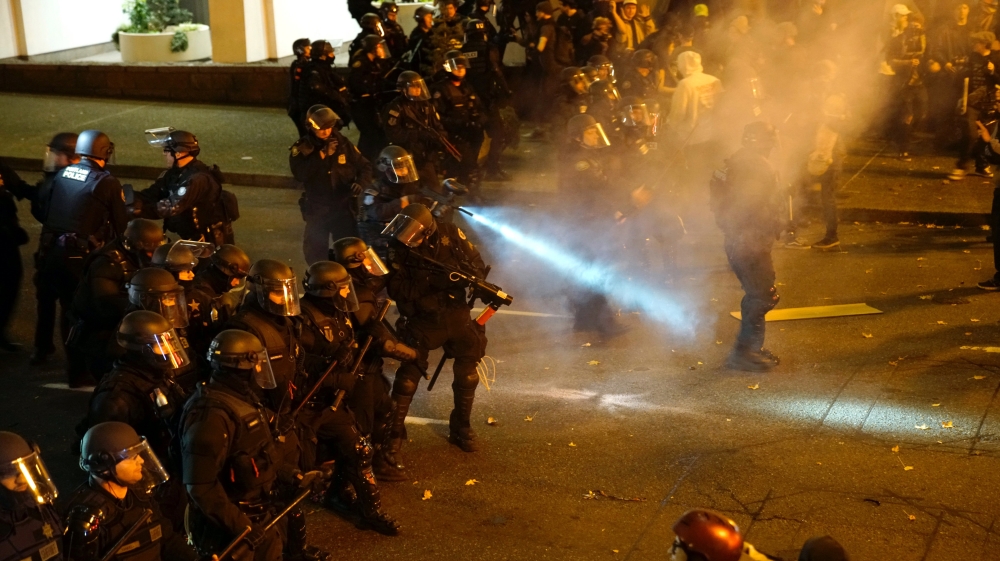 Police clashed with protesters in Portland, Oregon during anti-racism protests in the wake of Trump's election win [William Gagan/Reuters]