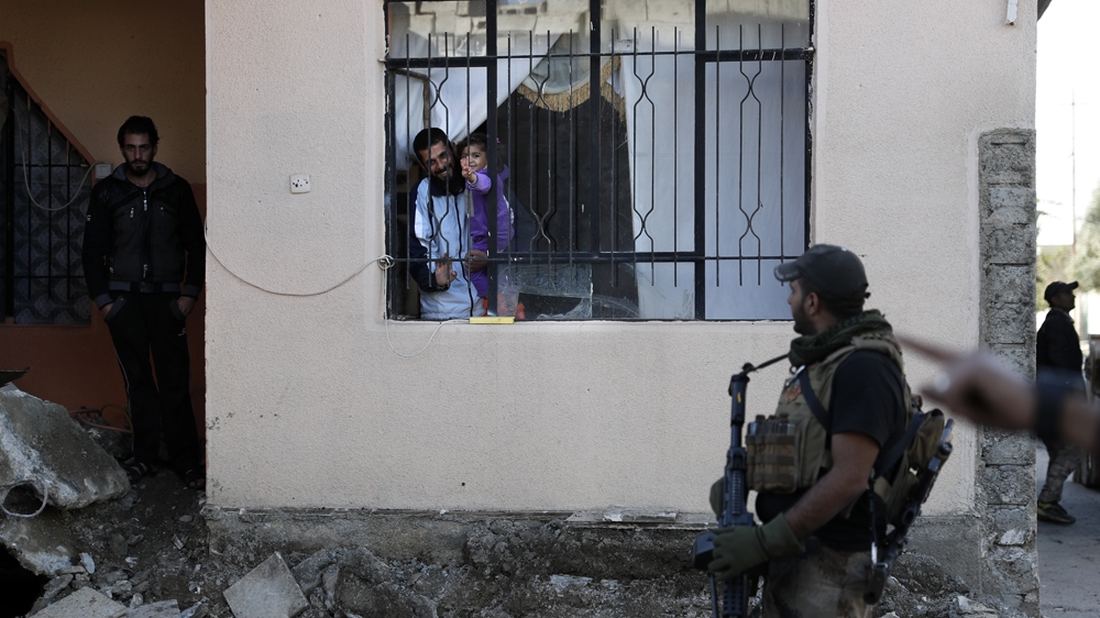 Iraqi military estimates put the number of ISIL fighters in Mosul at 5,000-6,000 [Thomas Coex/AFP]