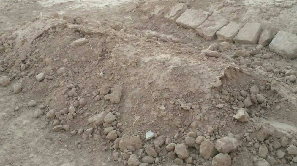  'ISIL had planted road bombs, and landmines, which pose a serious threat to any attempt at working on the site of the second mass grave for now' [Salam Khoder/Al Jazeera]
