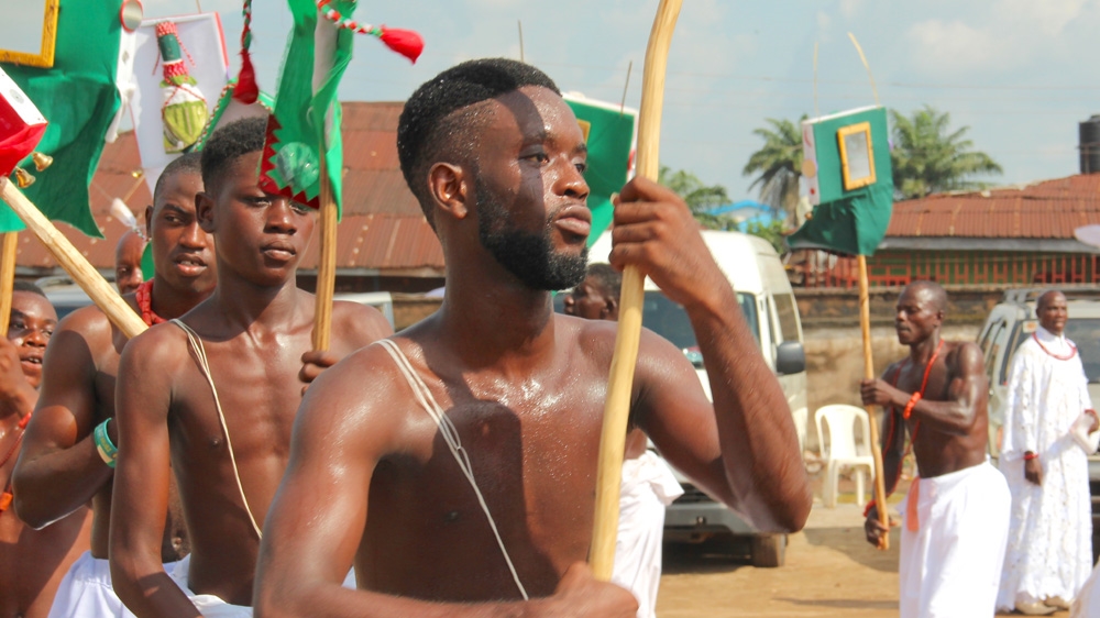The ekasa dancers ritually cleansing the ground the crown prince will soon walk on [Femke van Zeijil/Al Jazeera] 
