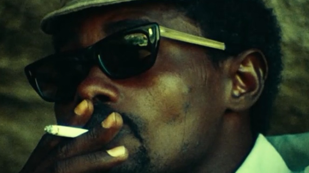 Habre wore a Cuban cap, Ray-Bans and a colt by his side, reminiscent of Cuba's revolutionaries, to remind people of his position as warlord. [Al Jazeera]