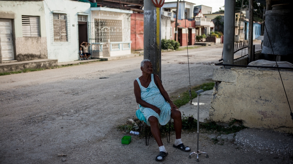 'I still love Castro very much,' says Caridad de Benitez [Alejandro Cegarra/Al Jazeera]