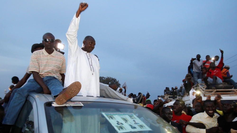 Supporters of the United Democratic Party (UDP) opposition alliance cheer for their presidential candidate Adama Barrow during a rally in Banjul, Gambia, November 29, 2016 REUTERS/Thierry Gouegnon