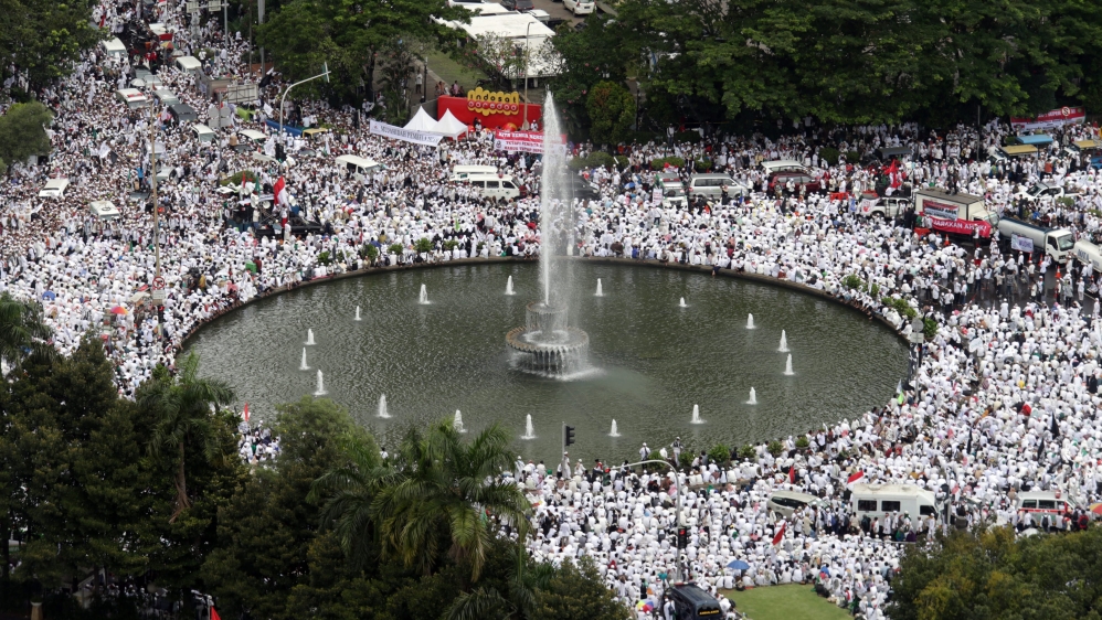 Police officials estimated that at least 150,000 people had gathered under drizzling rain   [Reuters]