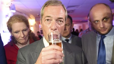 Nigel Farage is fond of being photographed with a pint of beer or cigarette in hand [Toby Melville/Reuters]