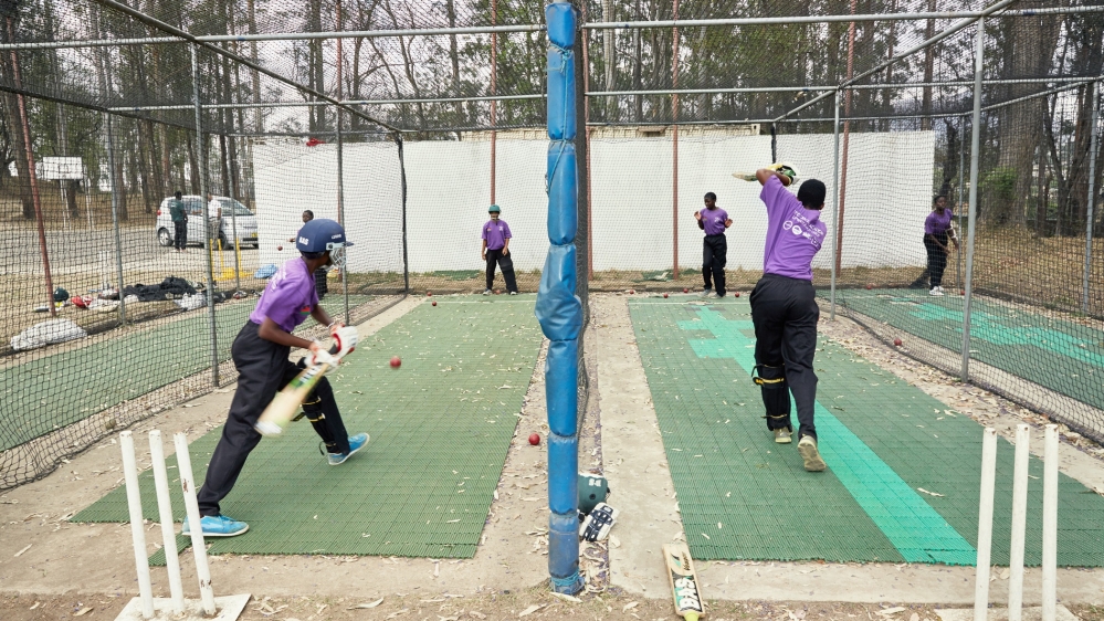 
Members of the Malawi Under-19 Women's Cricket Team during a practice batting session at their training grounds [Julia Gunther/Al Jazeera]
