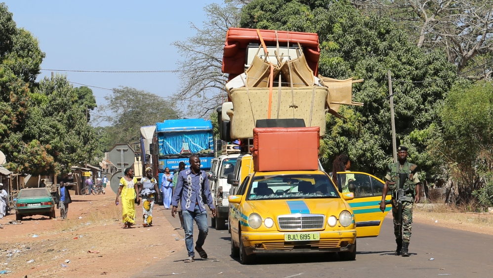 Cars line up at the border post check point in Seleki, Senegal, at the border with Gambia
