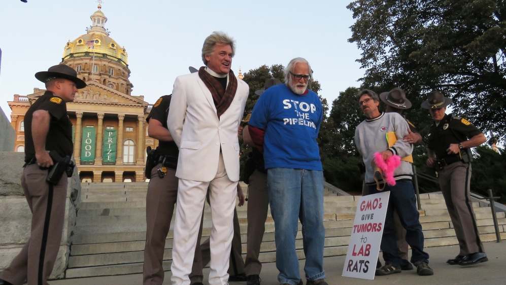 Reverend Billy getting arrested during an anti-Monsanto protest