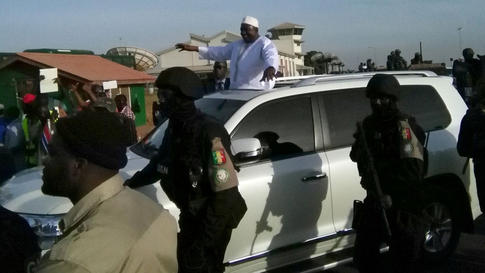  Barrow was driven in a motorcade after arriving in Banjul [Afolabi Sotunde/Reuters]