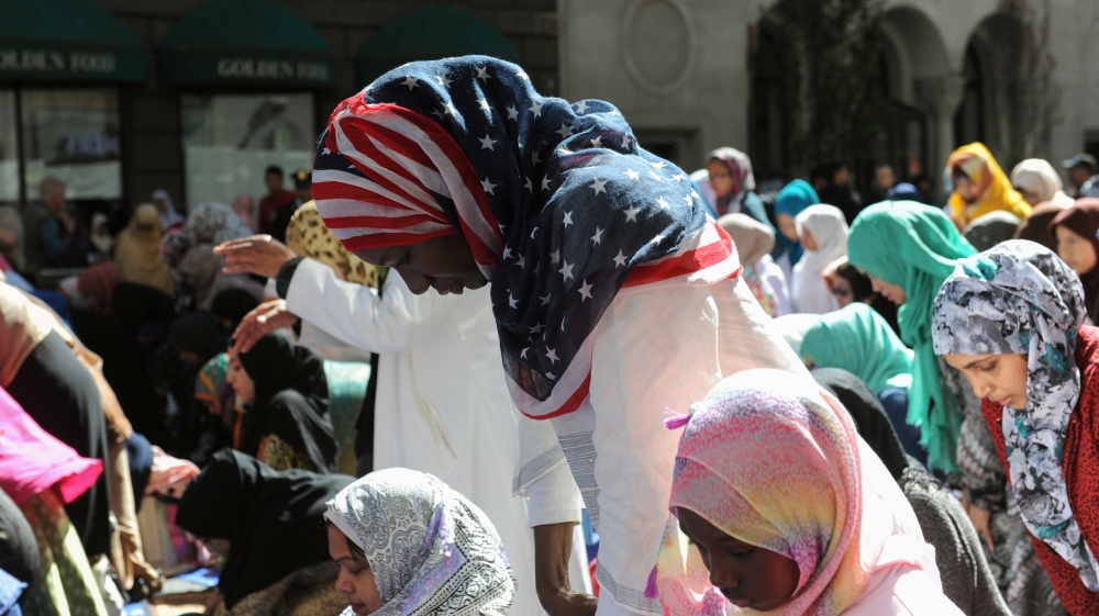 Women pray before the start of the annual Muslim Day Parade in the Manhattan borough of New York City